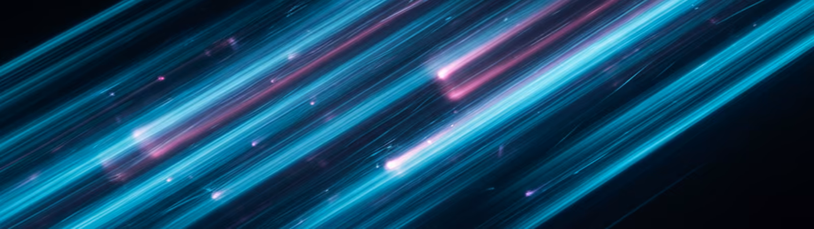 Cyan and electric blue light streaks on black